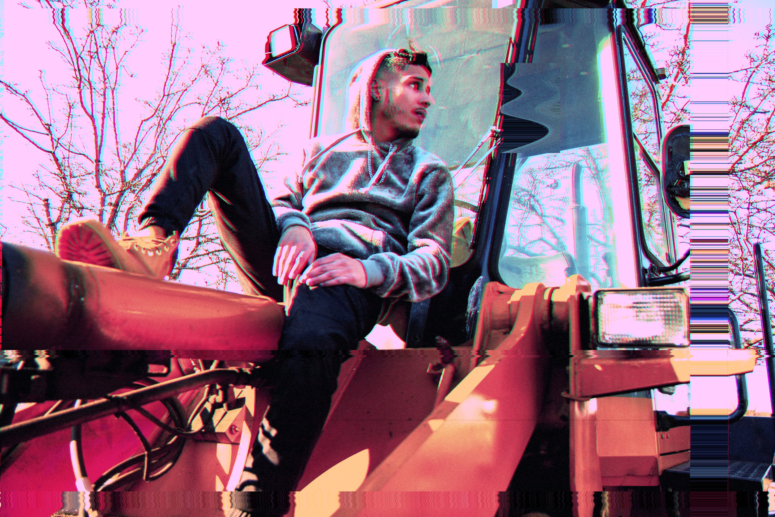 8waves seated on construction machinery in a glitch-art portrait